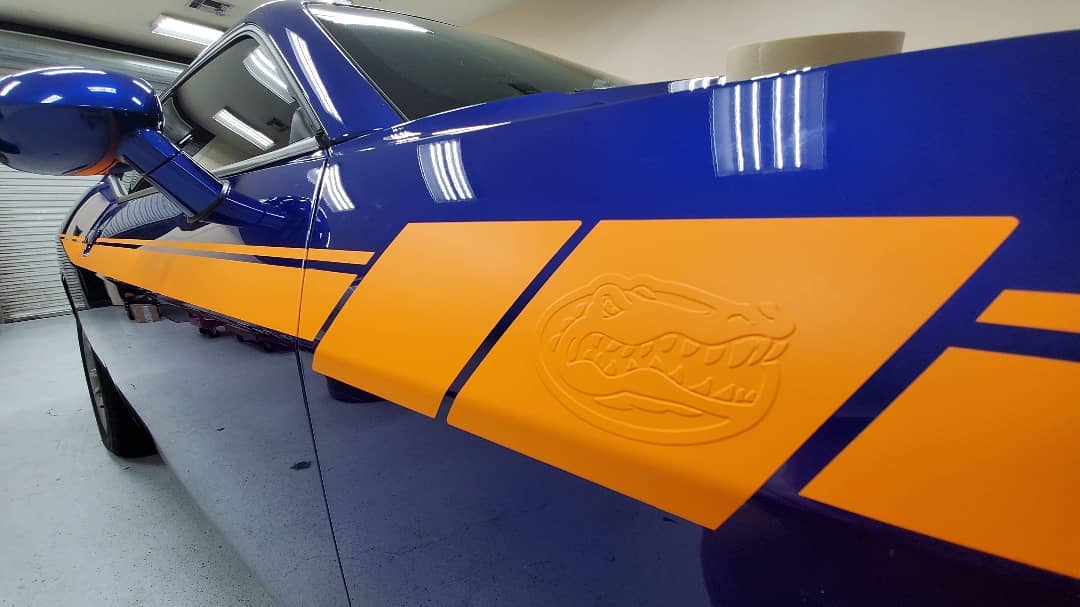 Blue Dodge with orange Gators Stripe on the side (1)
